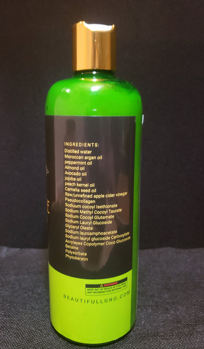 Bottle with green label and gold cap on a dark background