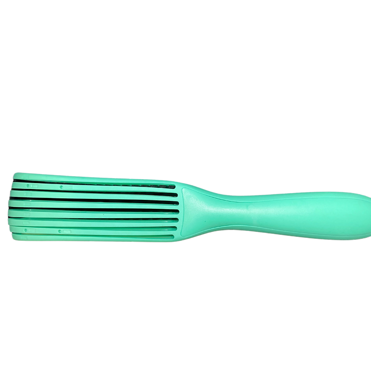 Green hairbrush on a white background