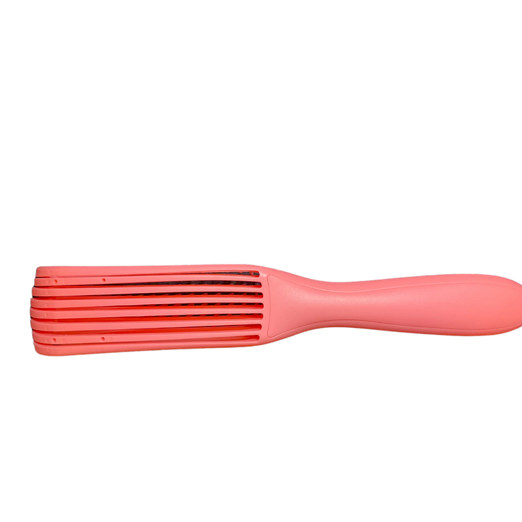 Pink hairbrush with a ribbed design on a white background