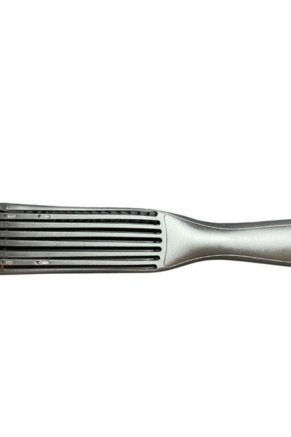 Metallic hair straightener on a white background